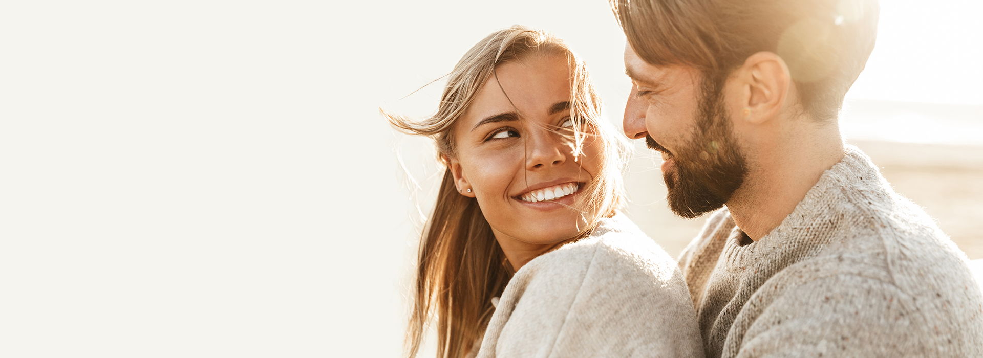 Man Kissing Woman With Pregnacare Logo