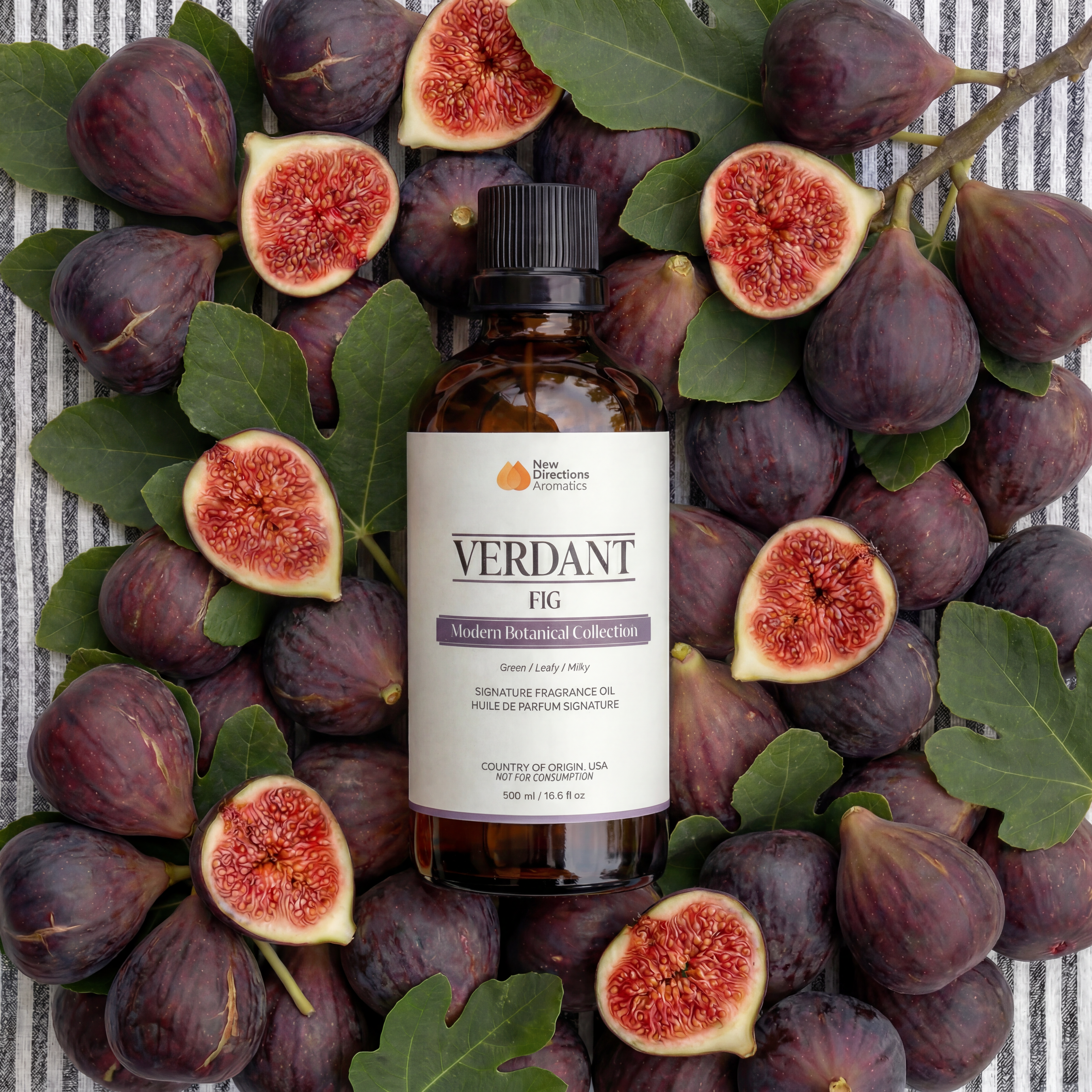 Fresh figs on a striped background, some cut in half.