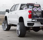 Rear view Cristian's Silverado with tailgate down showing HornBlasters air system in bed toolbox photo 2