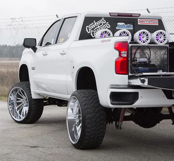 Rear view Cristian's Silverado with tailgate down showing HornBlasters air system in bed toolbox photo 2