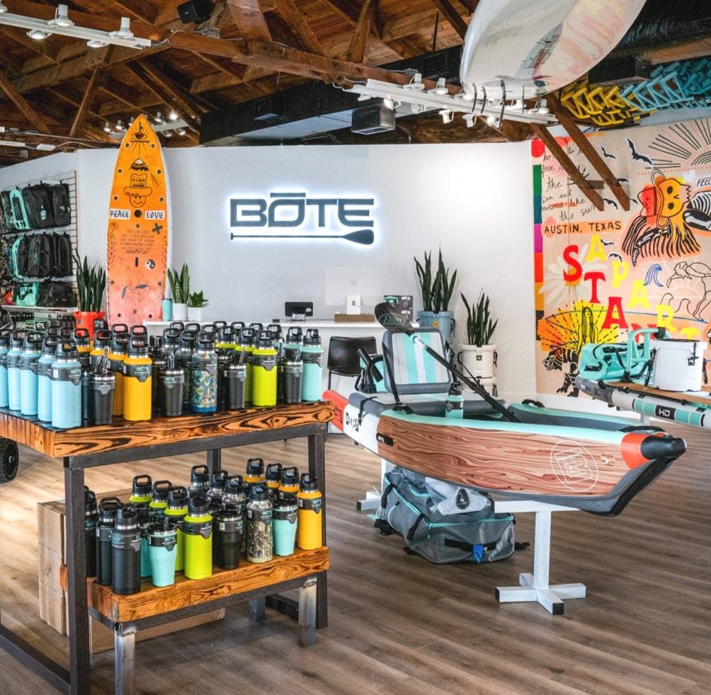 Picture of BOTE Austin store with drinkware and inflatable kayak
