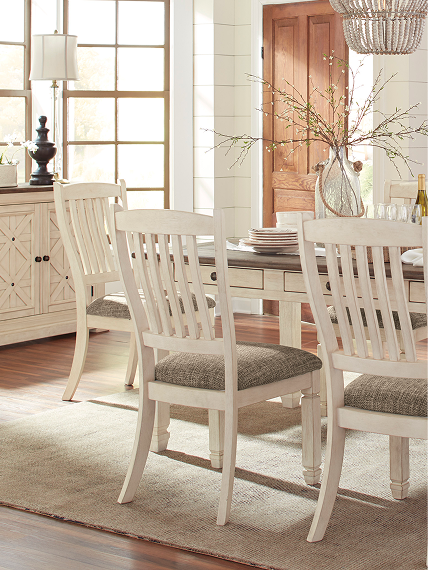 Light wood dining set in an airy room with soft neutral decor inspired by cottage-style living.