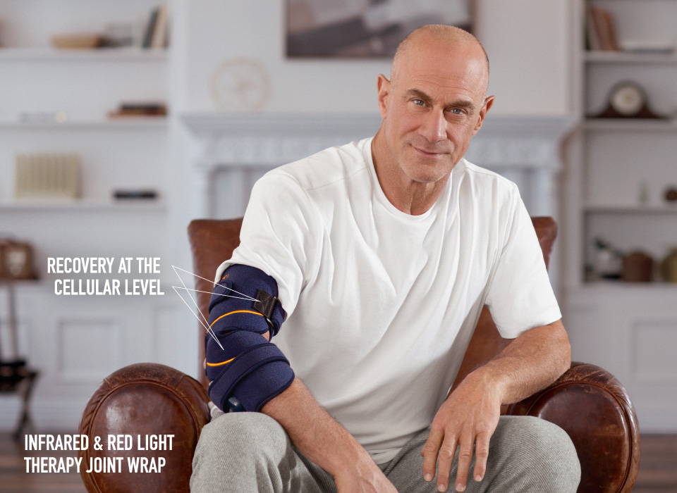 Christopher Meloni using the Infrared & Red Light Therapy Joint Wrap