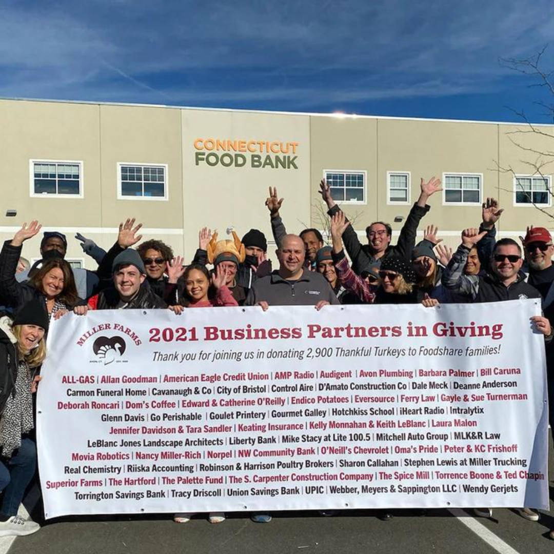 Oma's Pride employees in front of Connecticut Food Bank celebrating 2021 Business Partners in Giving.