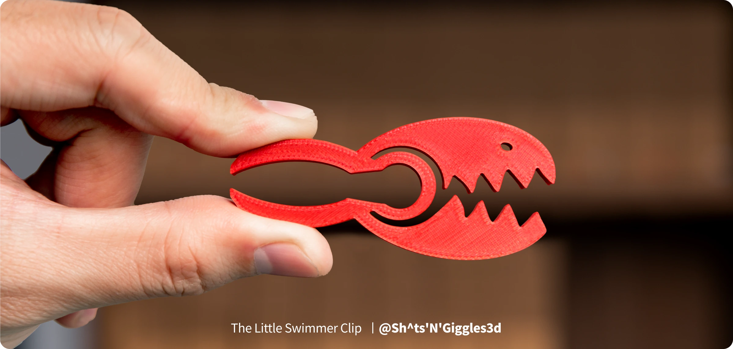 Red lobster clip printed with Snapmaker Silk PLA Filament(RFID), showing clean details and a smooth glossy surface.