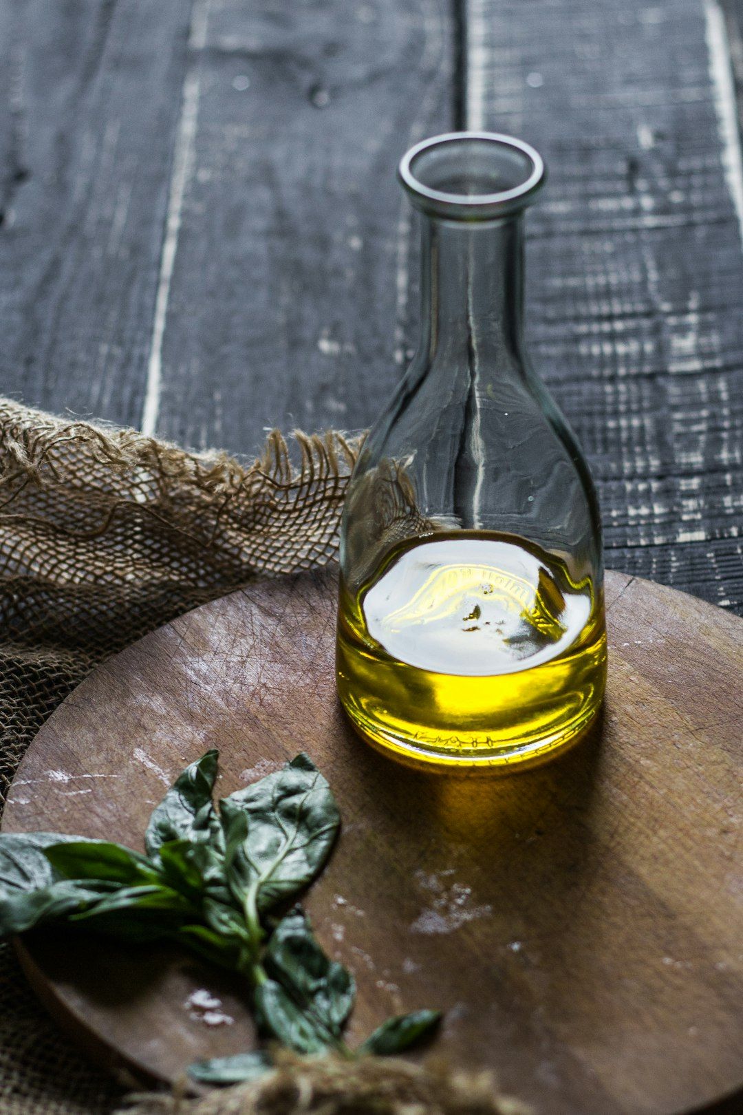 clear glass bottle with yellow liquid