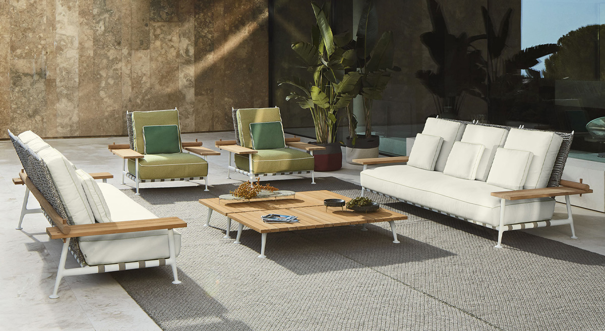 Modern Cassina outdoor seating area with sofas and armchairs.