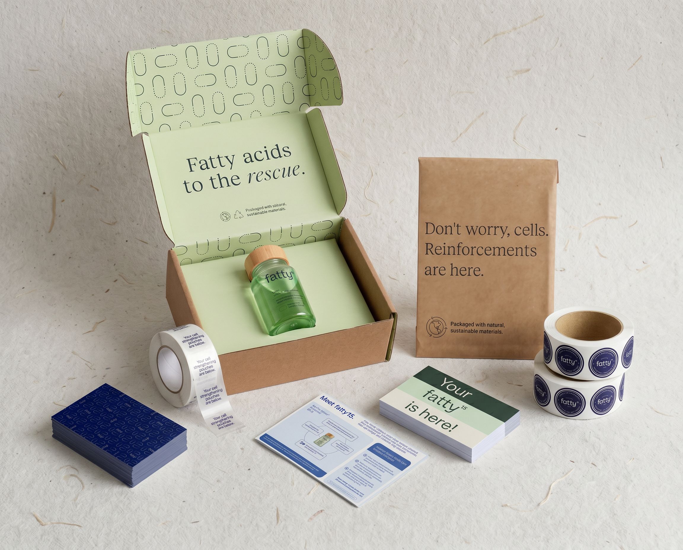 A subscription box with various items, including tape, labels, and a small bottle.