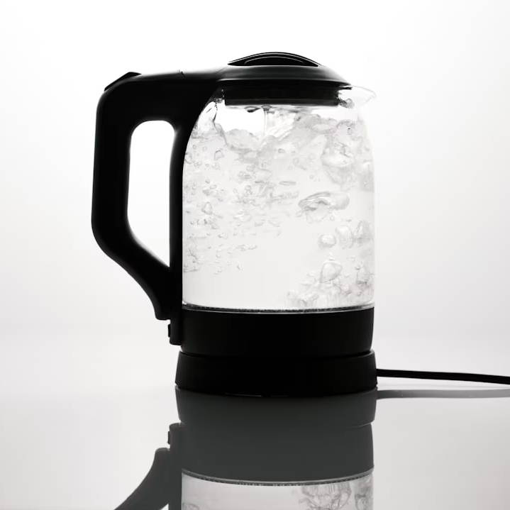 a black and white photo of a water kettle
