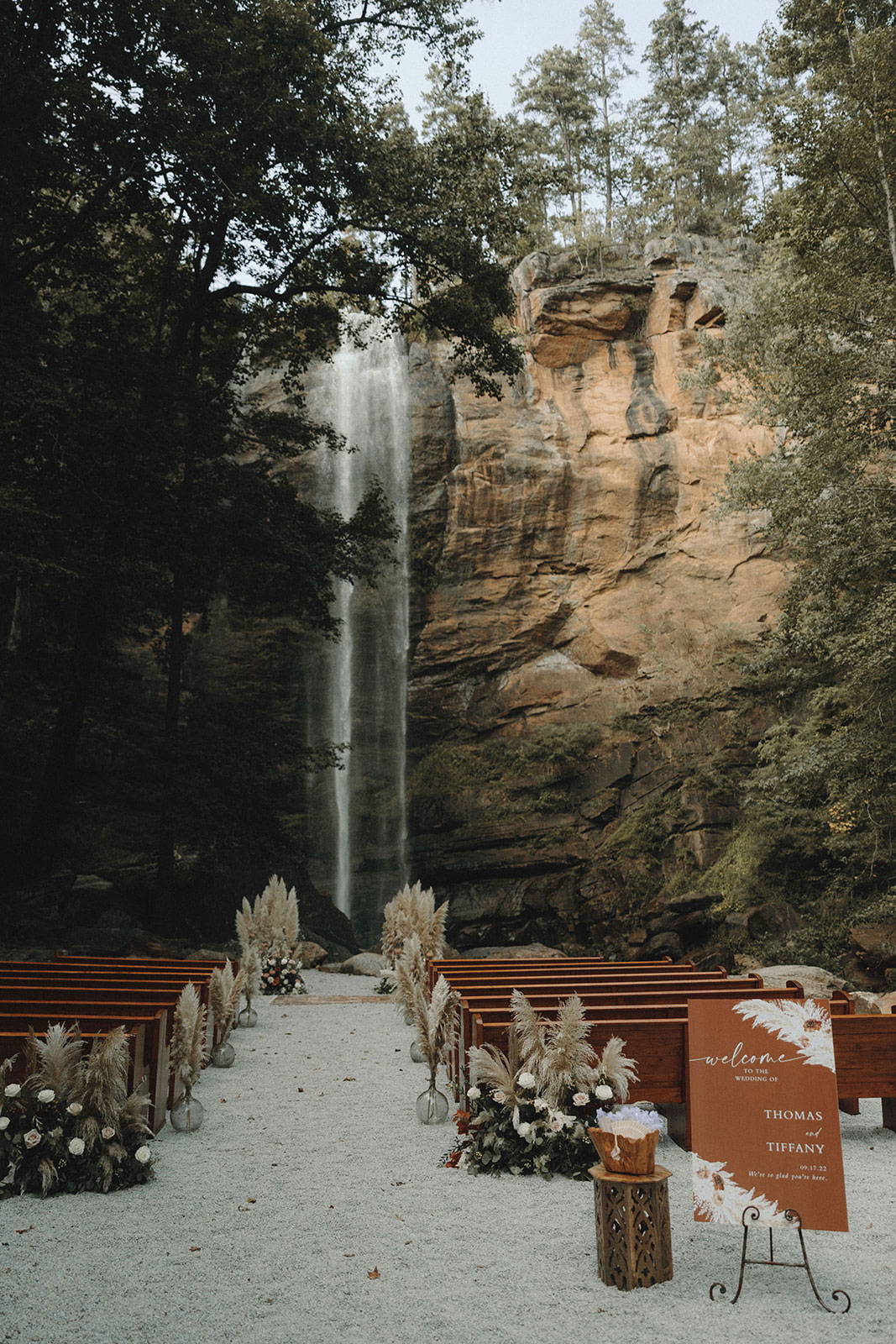Wedding ceremony setup with waterfall background