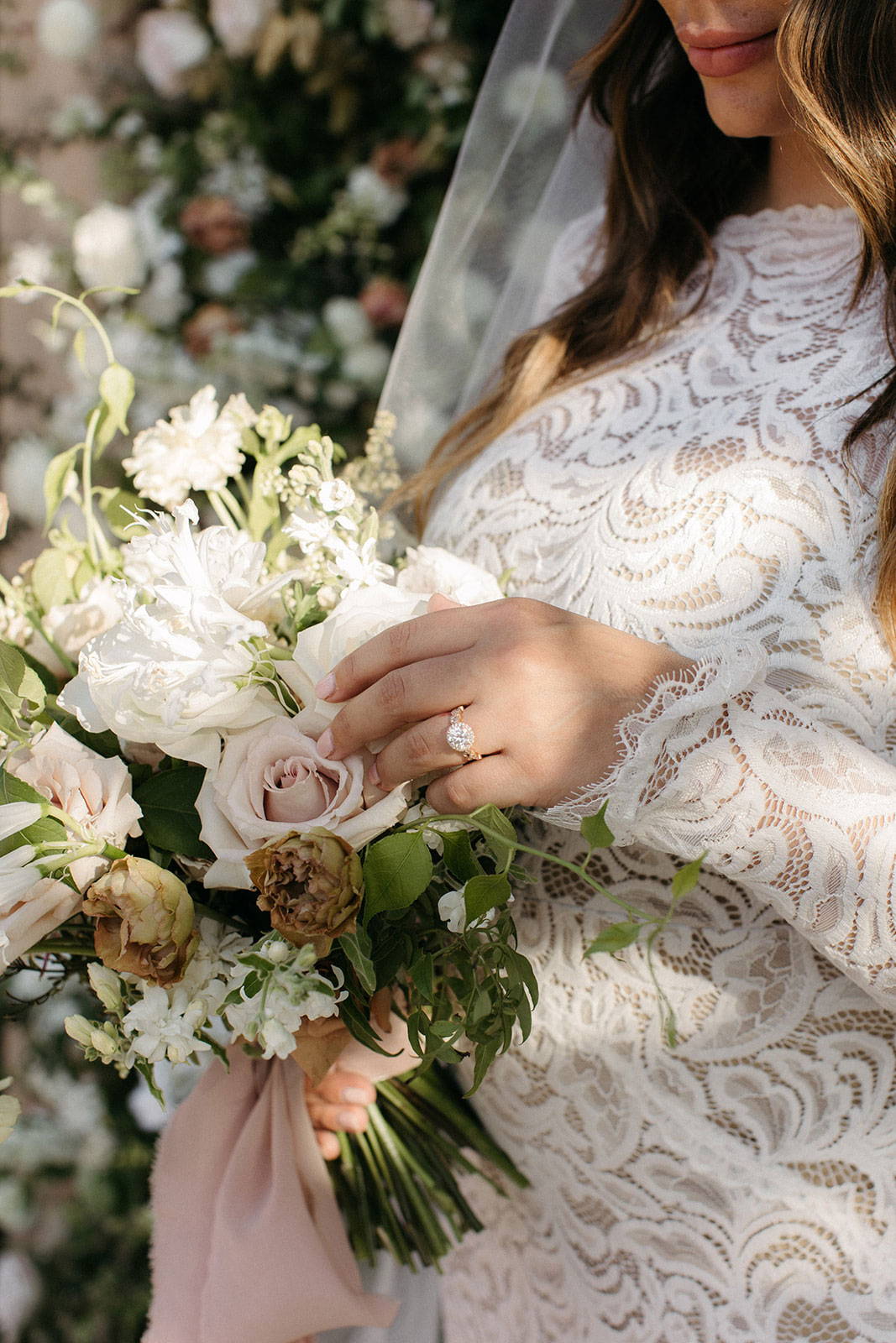 Bride holding floral bouquet