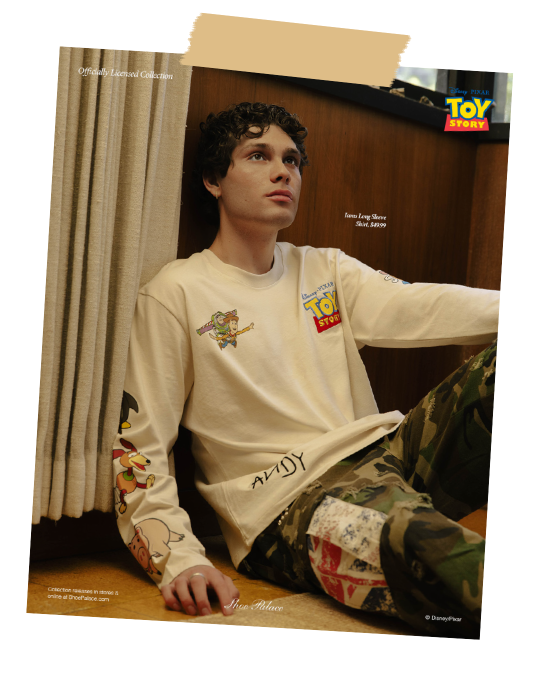 Person sitting on the floor, wearing a Toy Story-themed outfit.