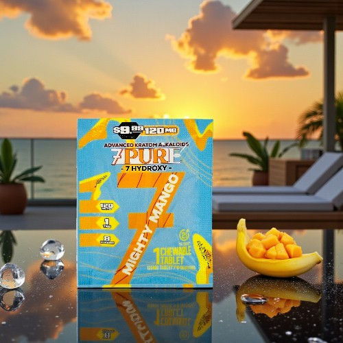 Box of mango-flavored product with sunset and tropical scenery in background.