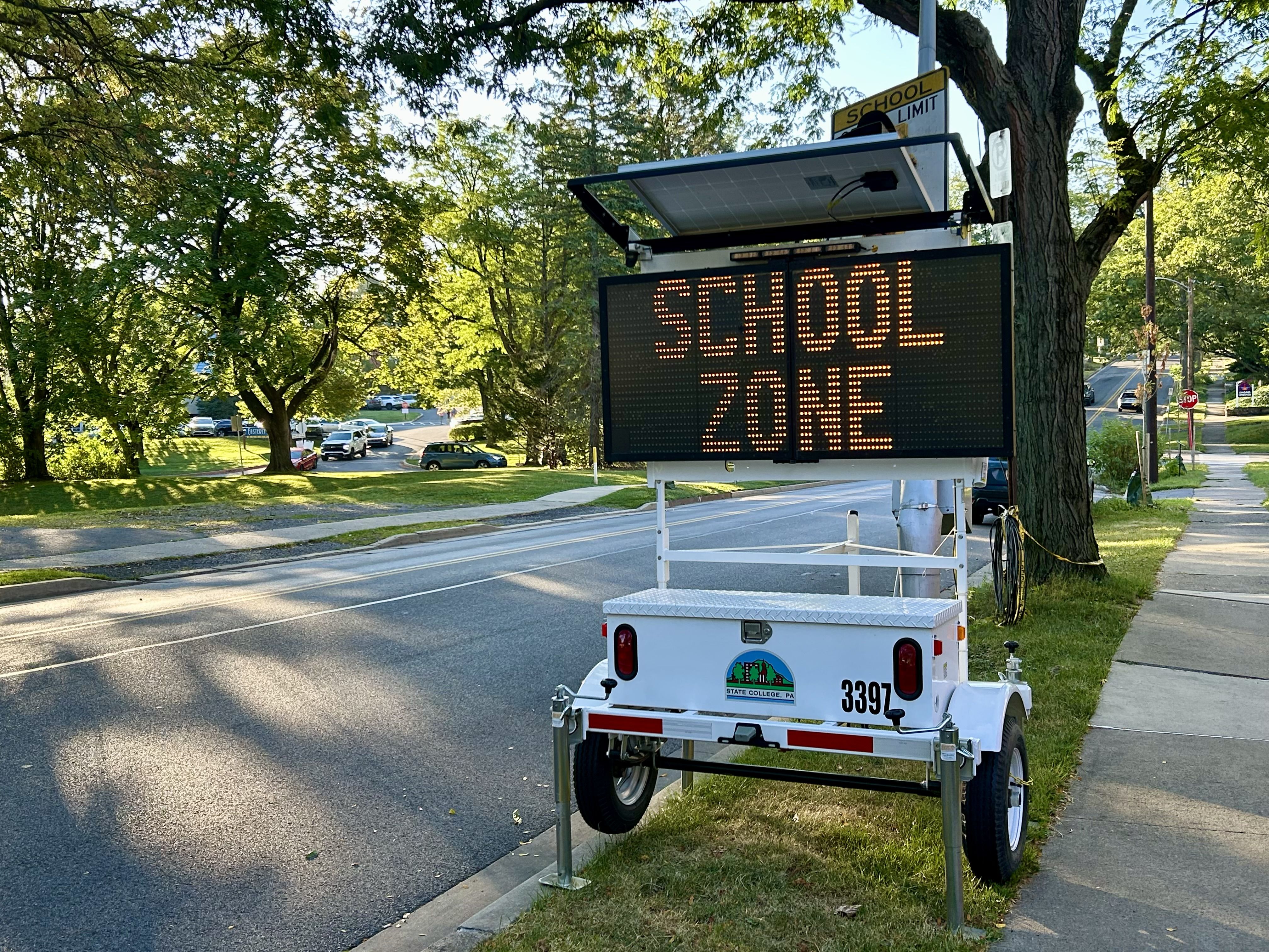 Radar speed and message trailer deployed on a roadside