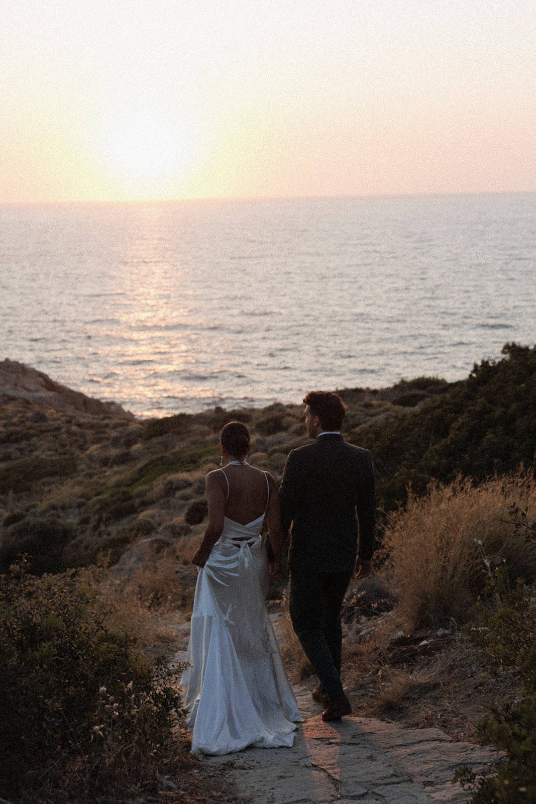 Bride and groom, enjoying the sunset