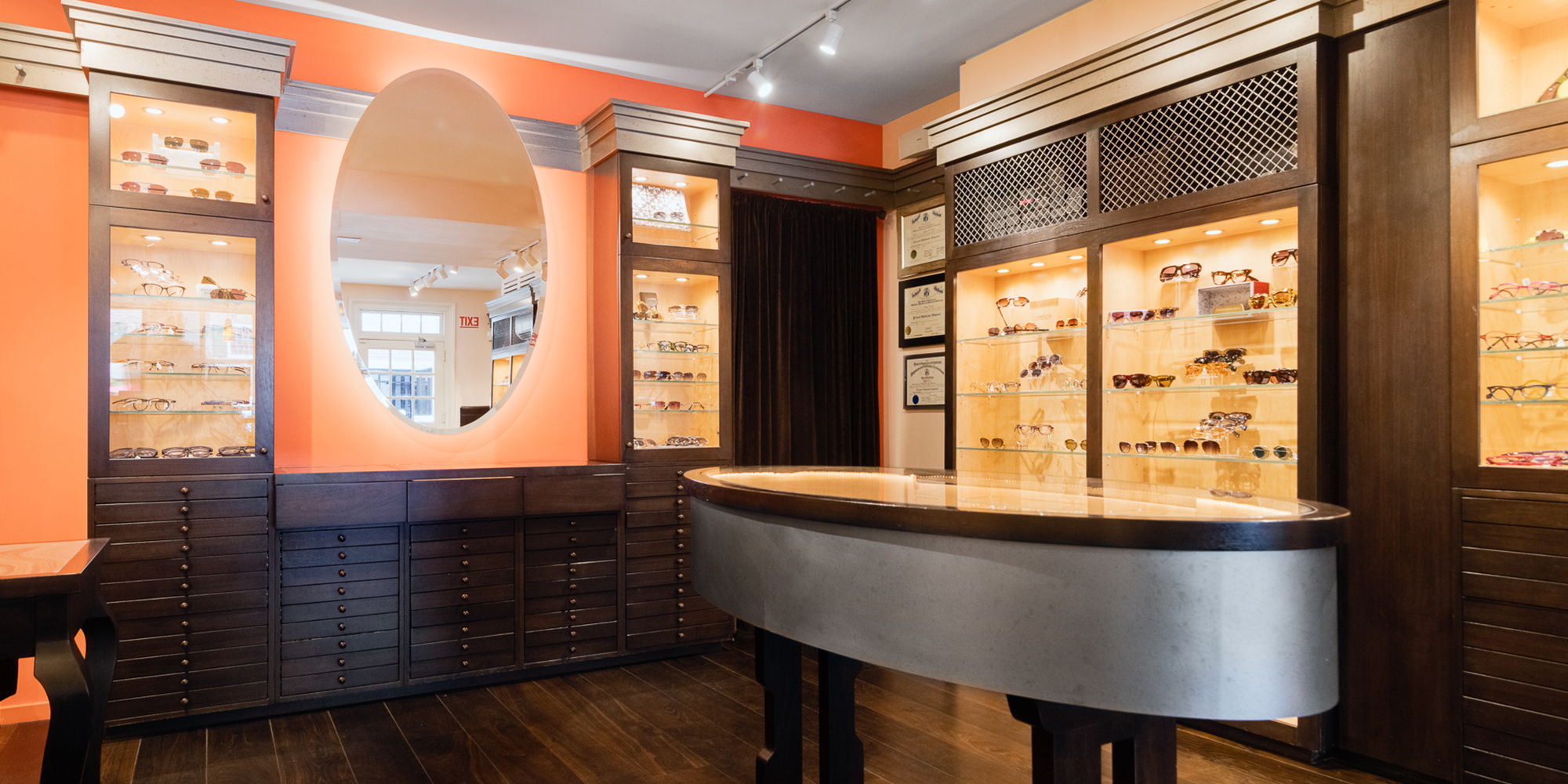 Interior of Morgenthal Frederics New Canaan with display shelves and a curved counter.
