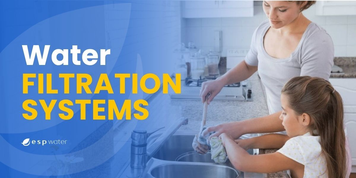 Woman and girl using a water filtration system in a kitchen.