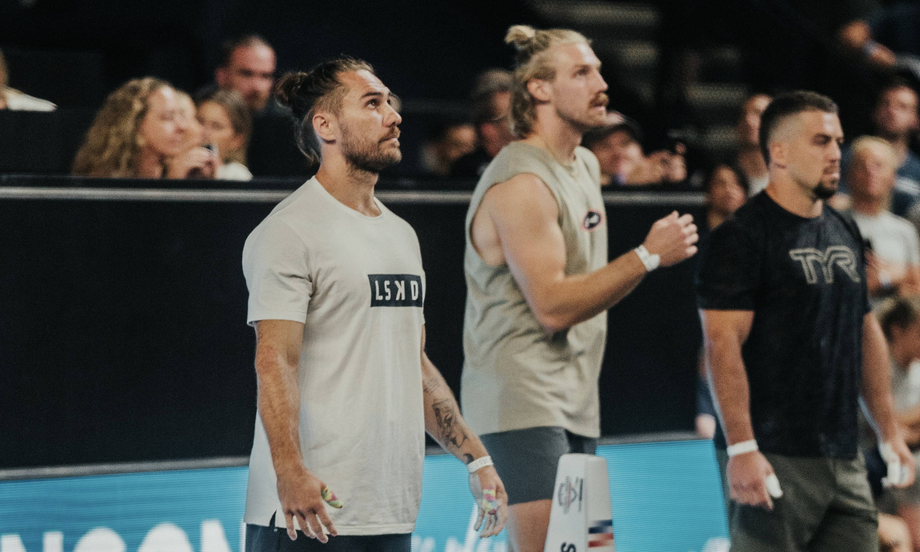 men standing at a crossfit competition