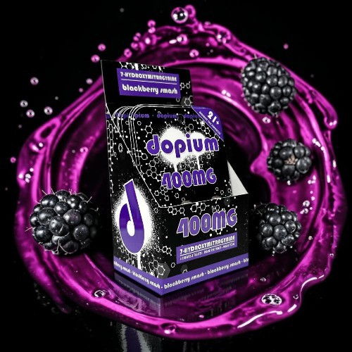 A purple-themed product packaging with blackberries and liquid splash effect.