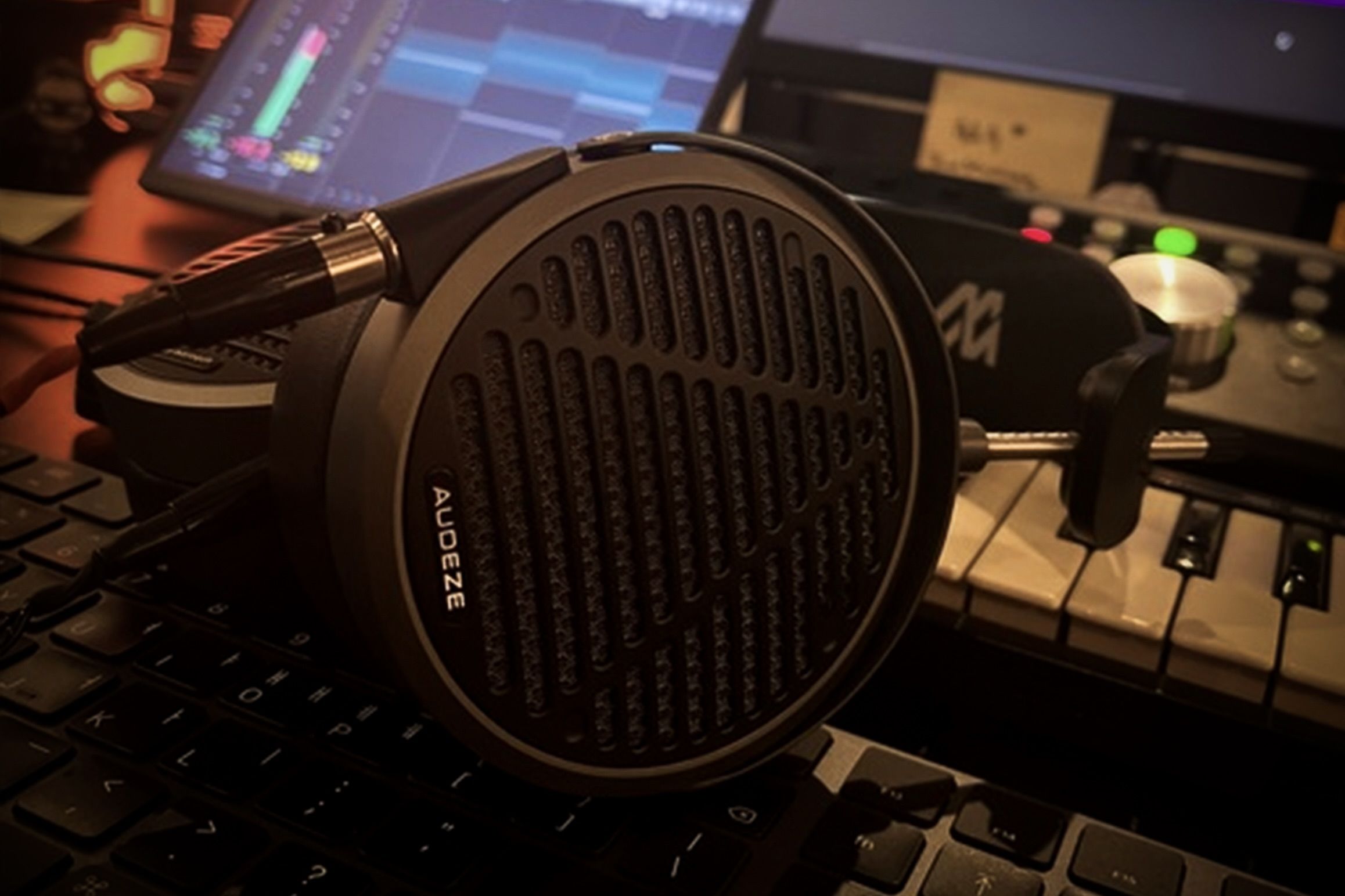 Audeze MM-500 headphones laying on keyboard in the studio