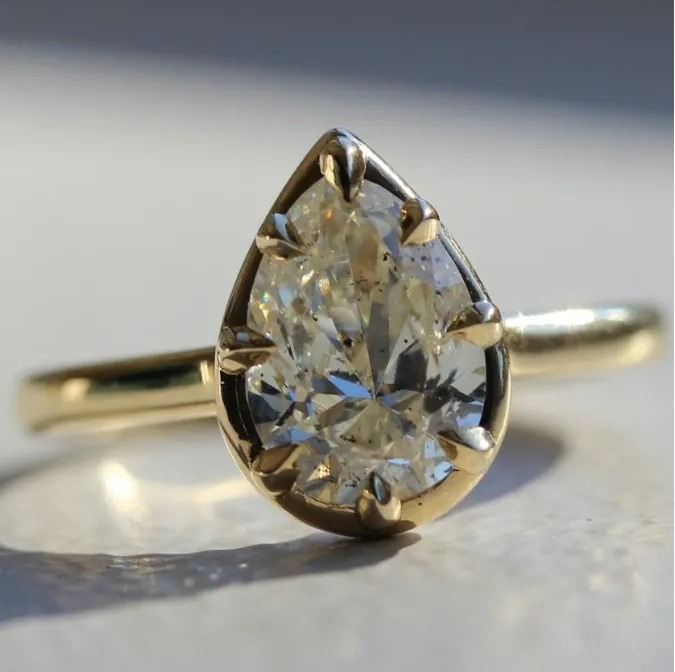 Pear Shaped Diamond Ring With 8 Claw Prongs