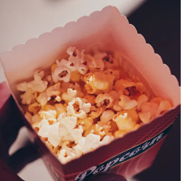 A tub of popcorn for a movie night.