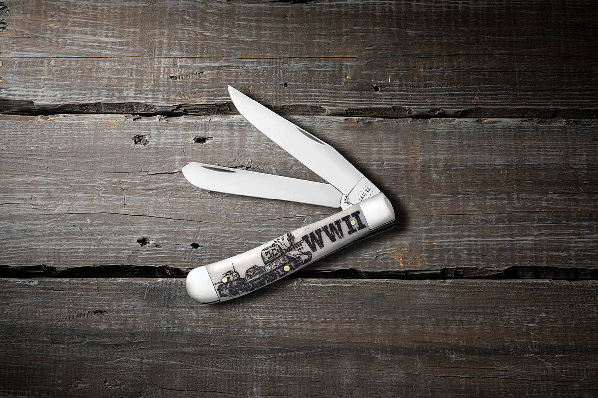 War Series WWII trapper knife on rustic wood table background.