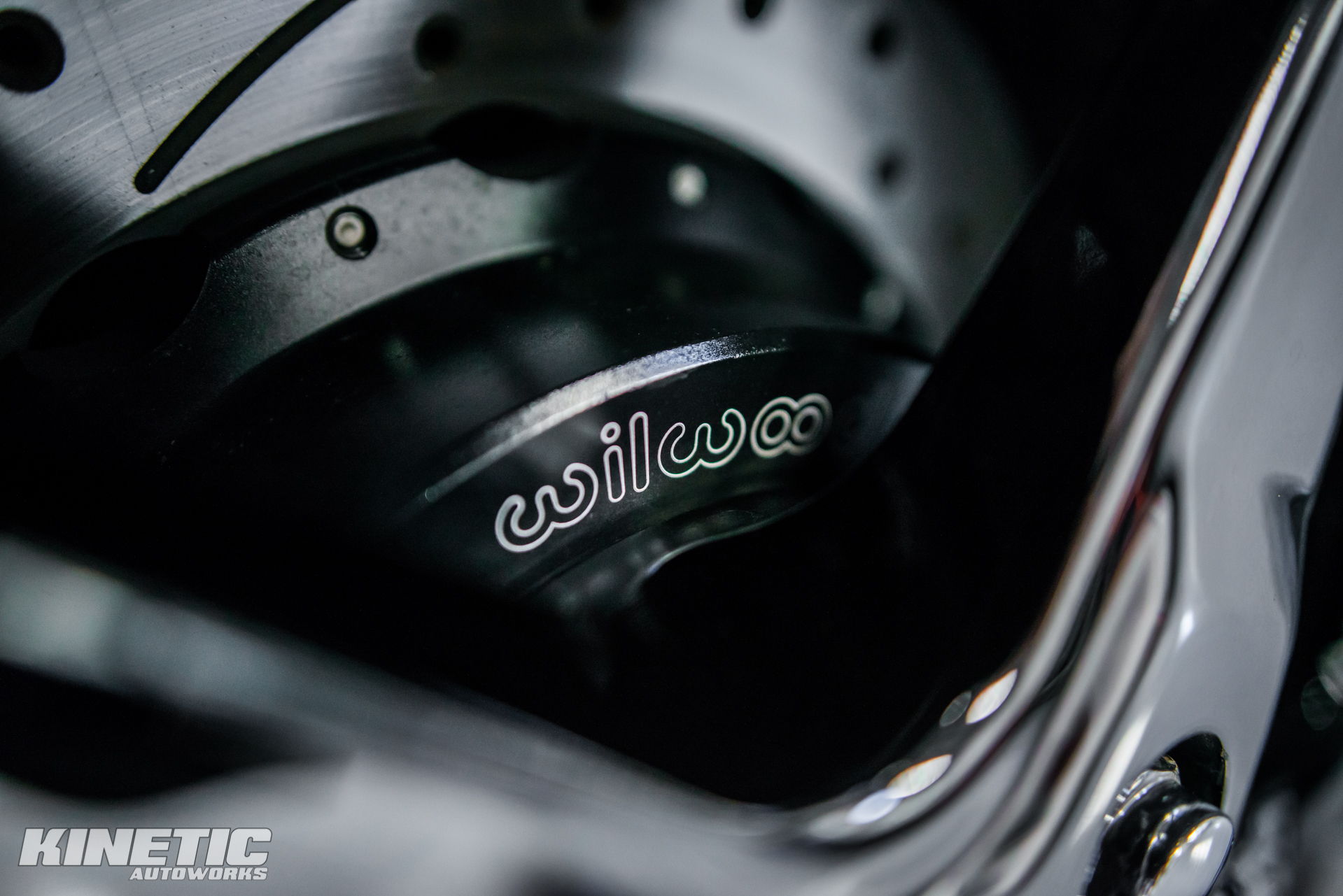 Wilwood brake assembly visible through a wheel at Kinetic Autoworks