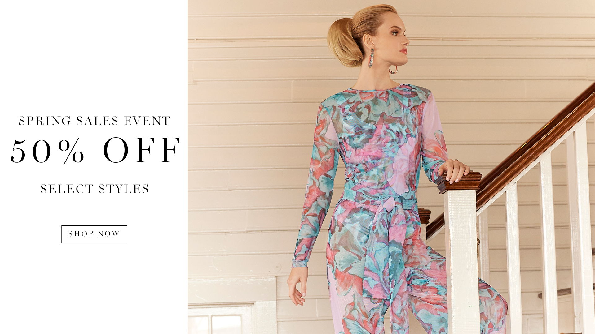 Woman in colorful dress promoting 50% off spring sale.