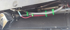 2016 Jeep Cherokee with HornBlasters Sniper Electric Horn behind the grille