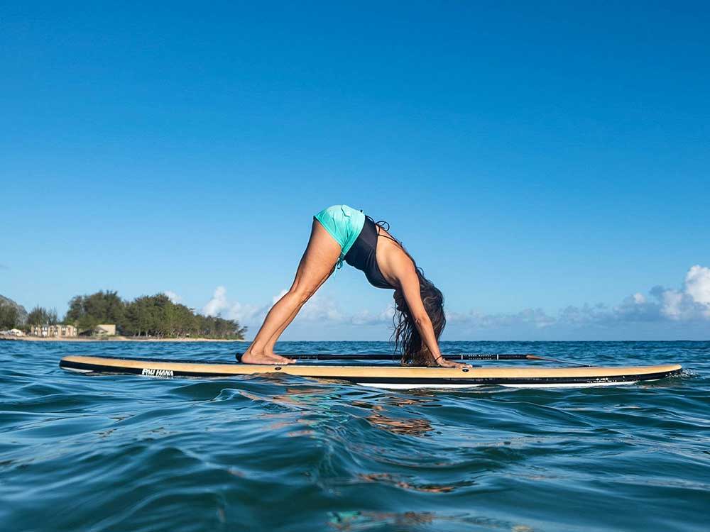 doing yoga on the big ez hawaiian vft stand up paddleboard