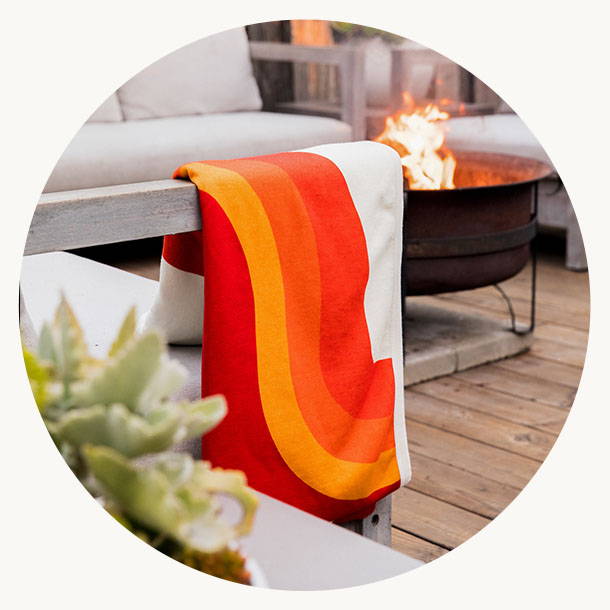 CozyHemp Blanket hanging off side of couch