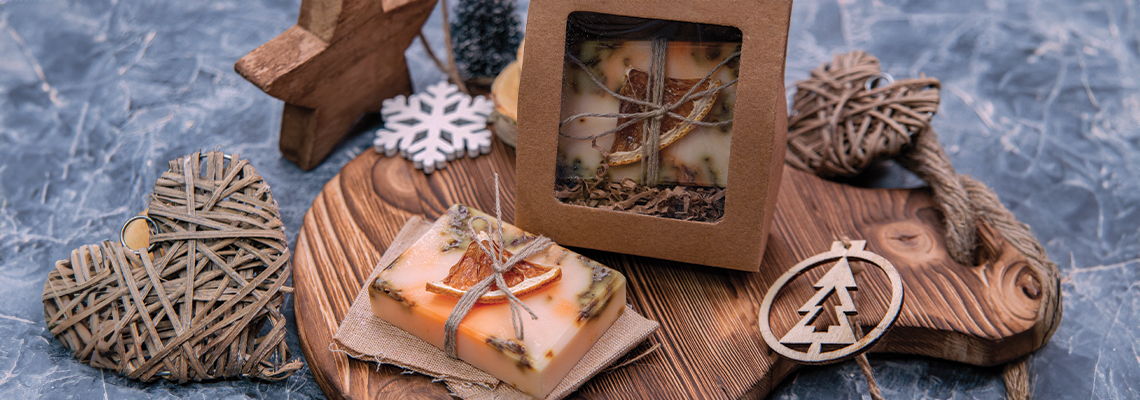 Decorative items and gifts arranged on a wooden surface.