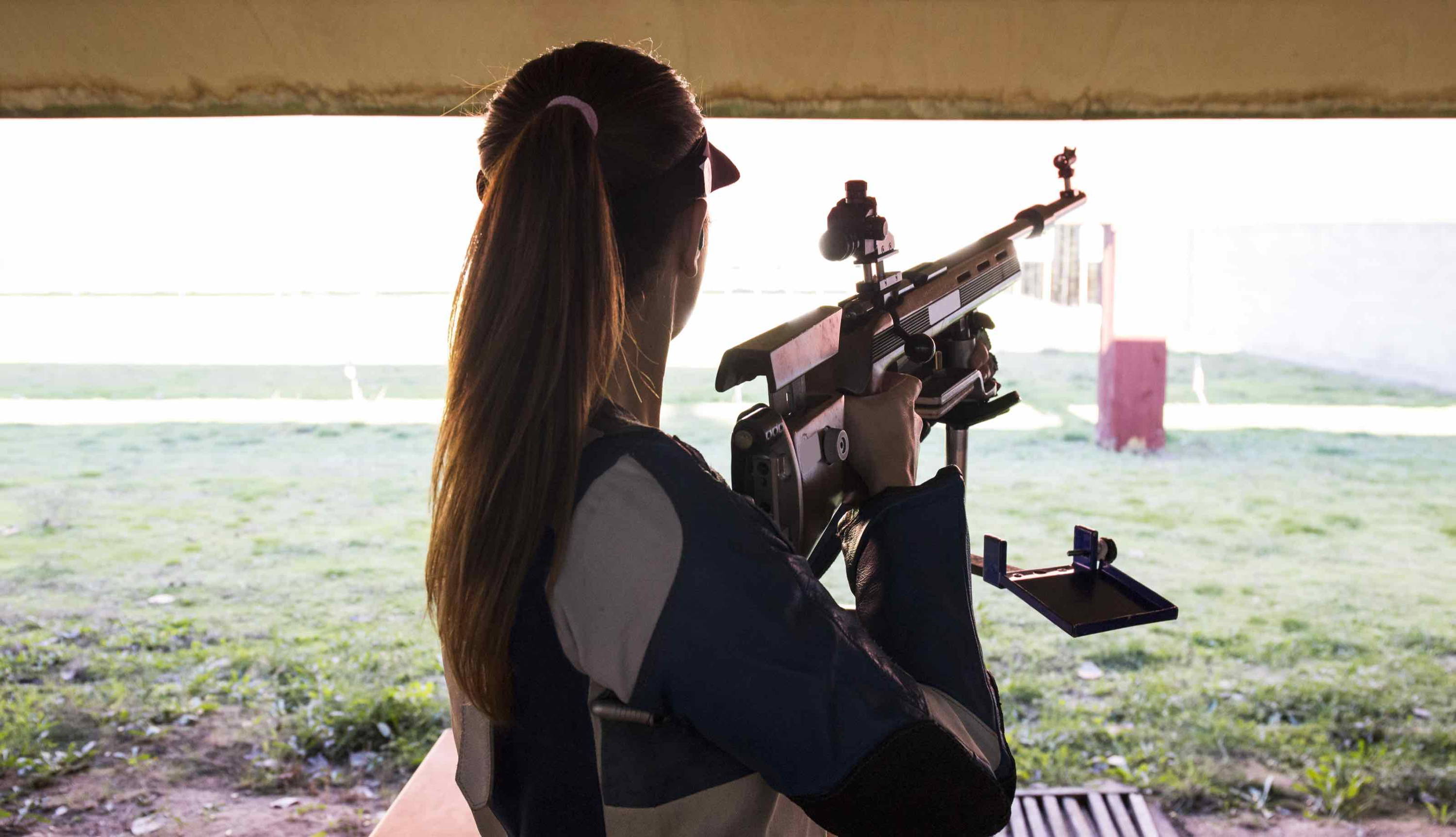 Woman shooting at shooting range