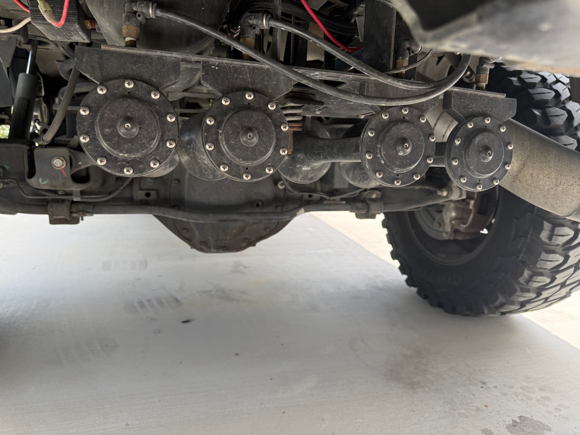 Bryan's 2020 Dodge Ram 2500 Laramie train horn installation detail with Spare Tire Delete Kit photo 3