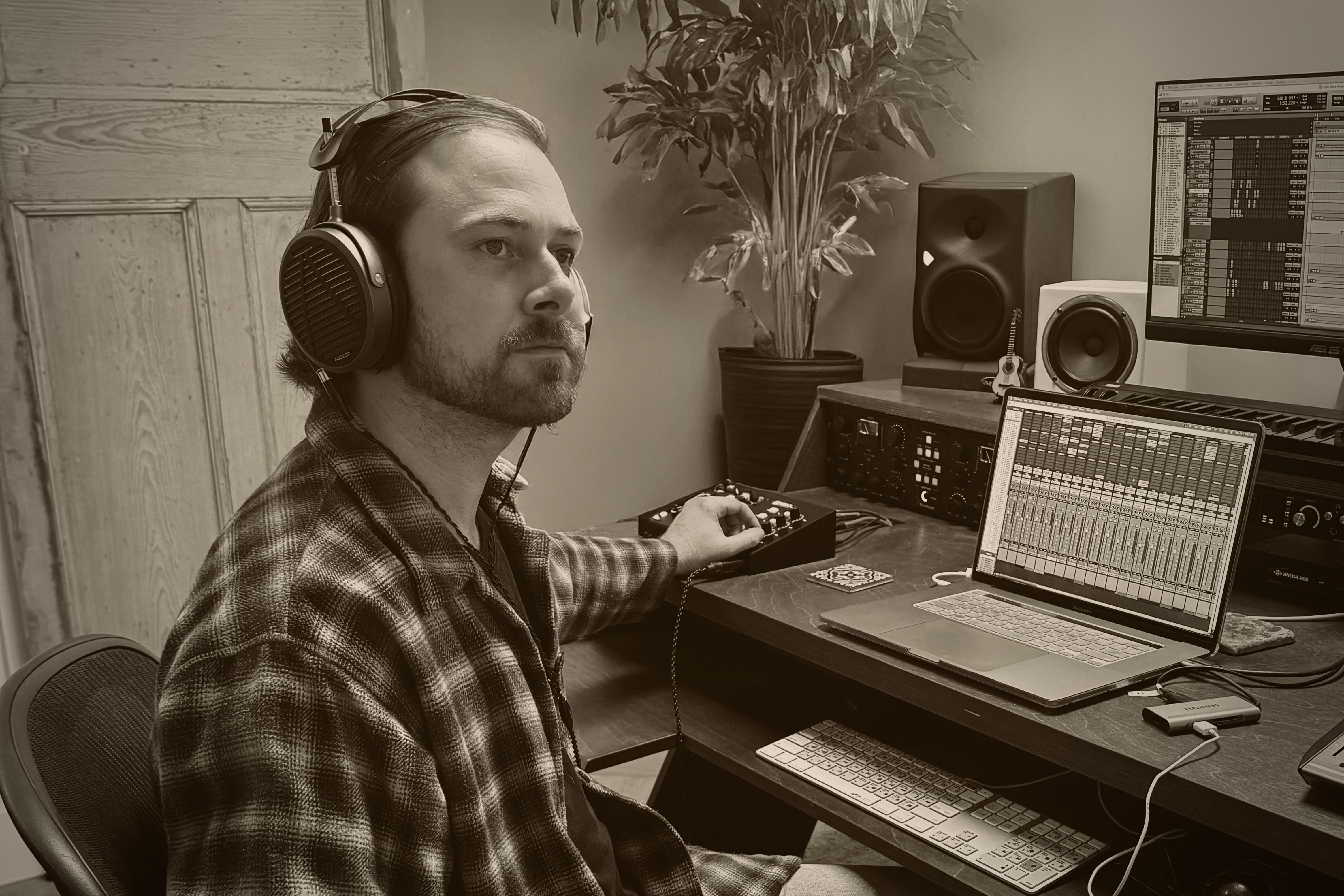 Harrison Long wearing Audeze MM-500 headphones in the studio