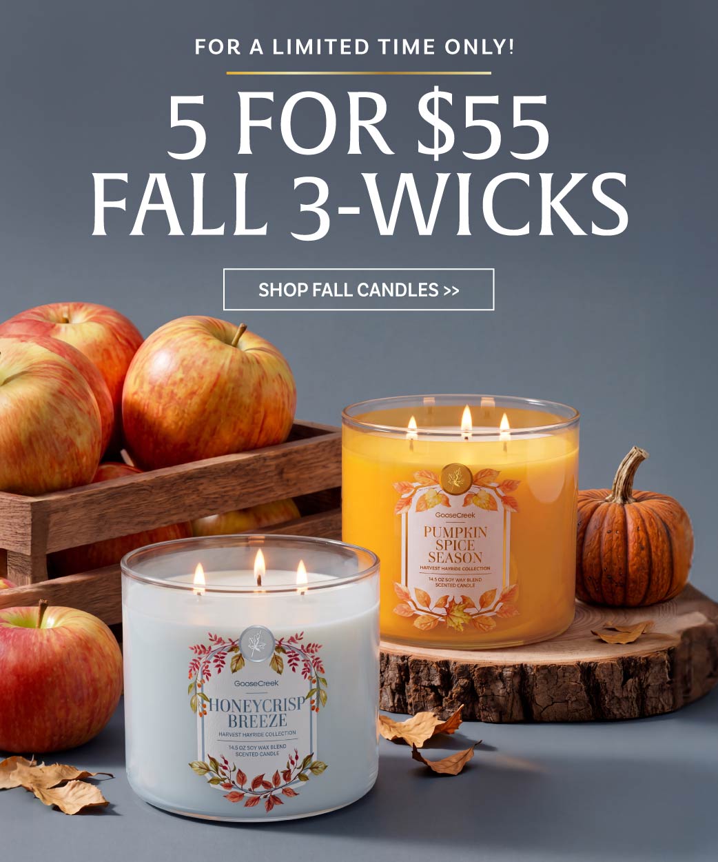 Promotional image for fall candles, featuring three-wick candles and apples.