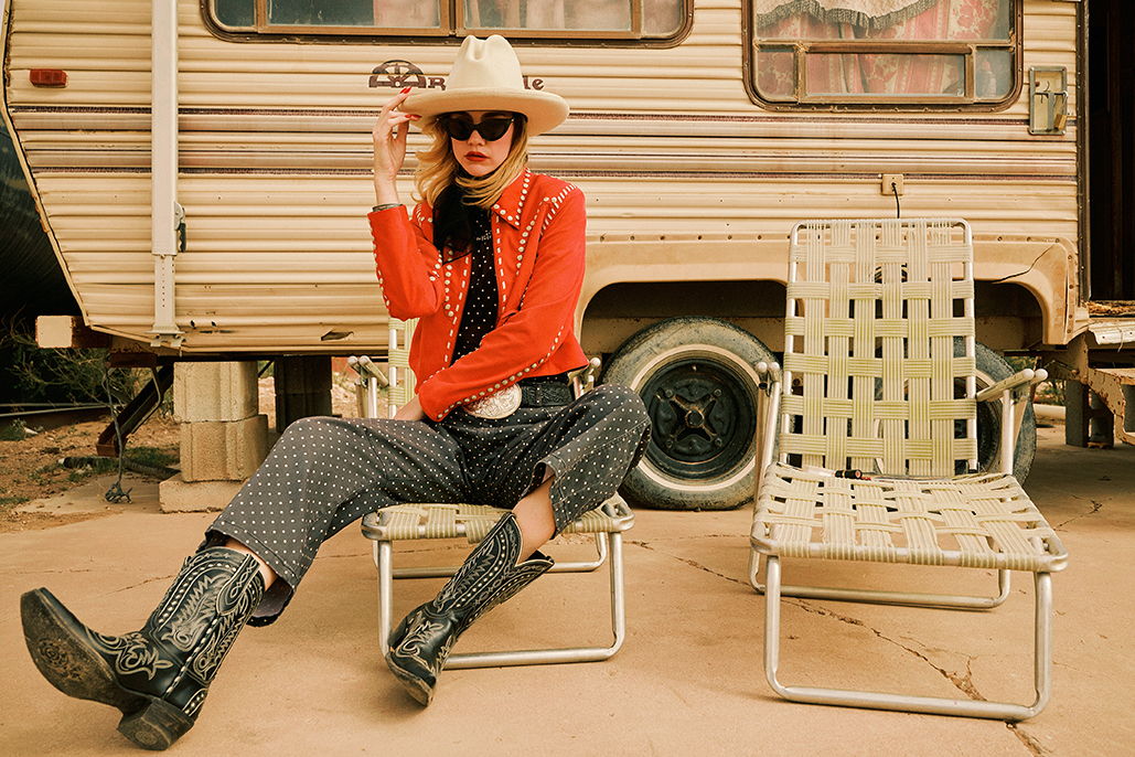 Lozzie wearing the Odessa Jacket with the Peggy Barrel Pant and the Texas Jack Boot in black with Double D Ranch accessories.
