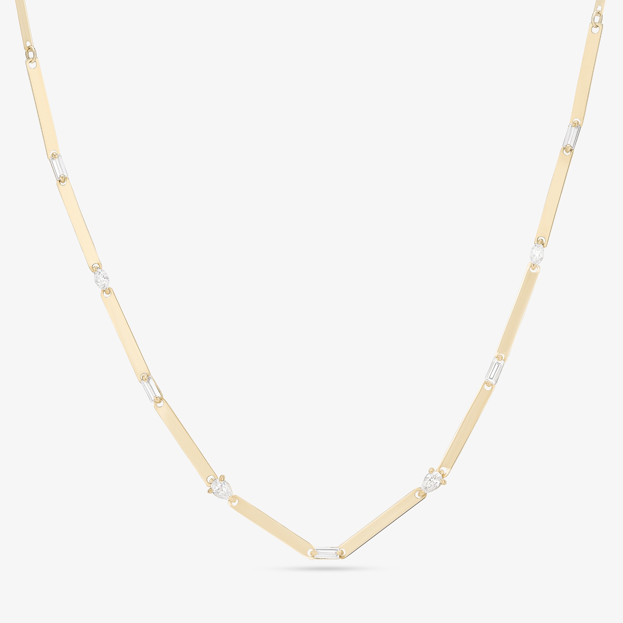A gold and silver necklace with geometric links and accents.