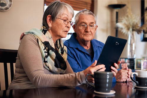 man and woman reading about pelvic floor