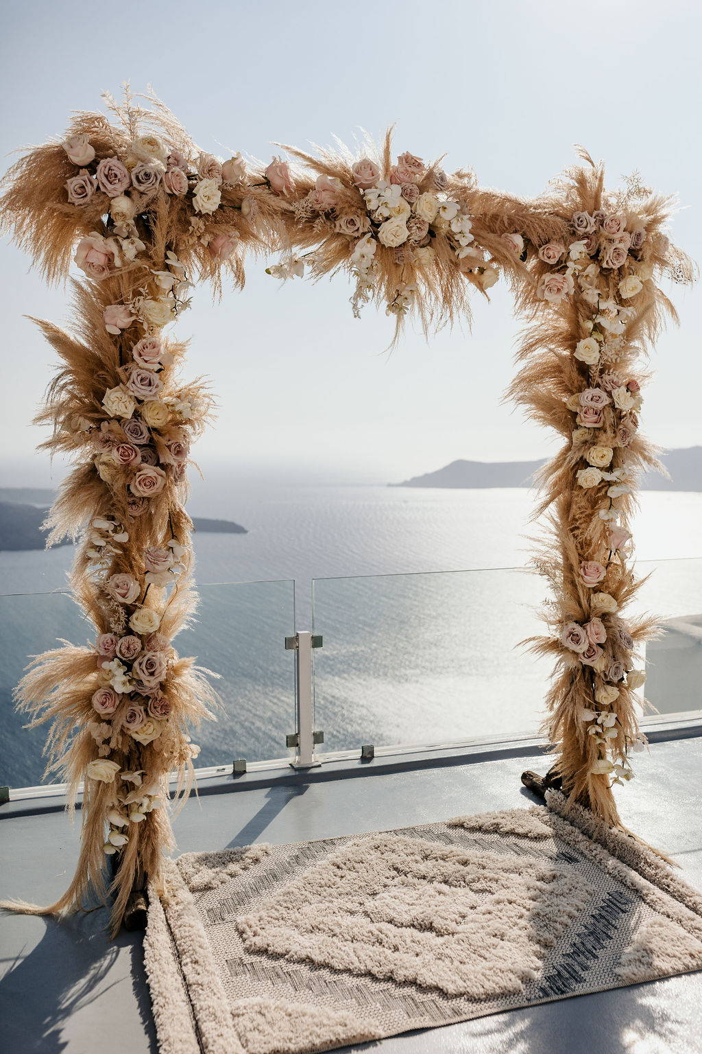 Destination wedding with boho wedding arbor