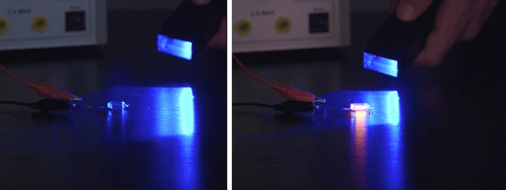 Figure 5. The energy of blue light can cause electron conduction in a small neon bulb. The bulb stays on because plasma conducts better than rarefied neon.