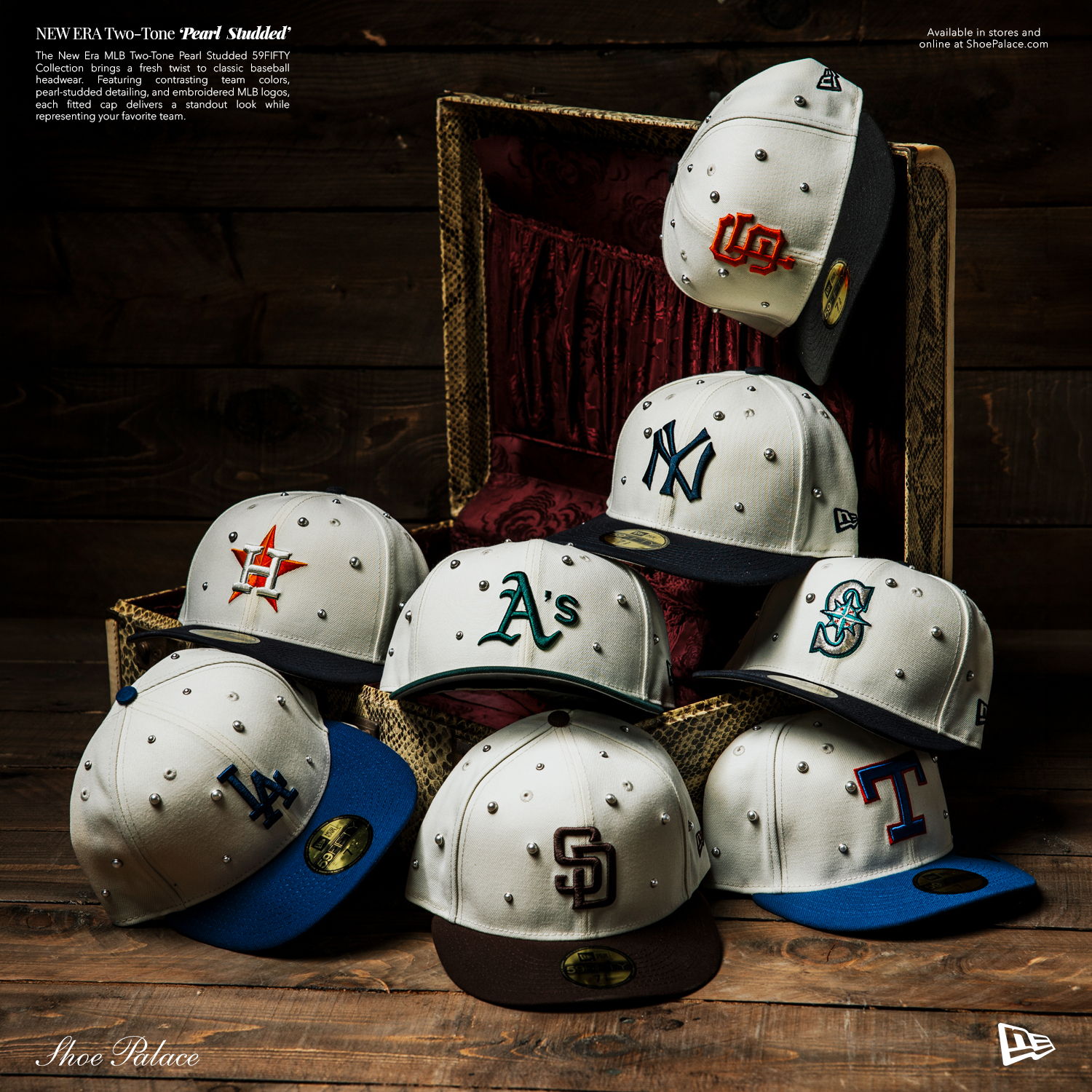 A collection of various baseball caps arranged artistically on a wooden surface.
