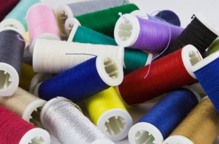Many different spools of thread