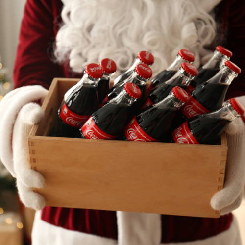 Santa holding a case of Coke