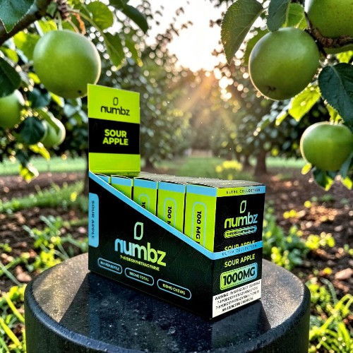Box of Numbz Sour Apple product with green apples in the background.