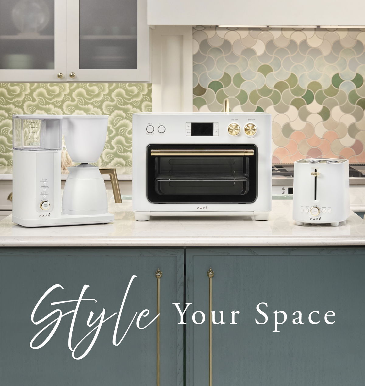 Kitchen appliances arranged stylishly on a countertop with decorative background.