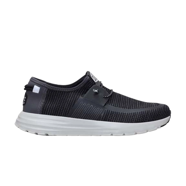 Black athletic shoe with a white sole and mesh upper.