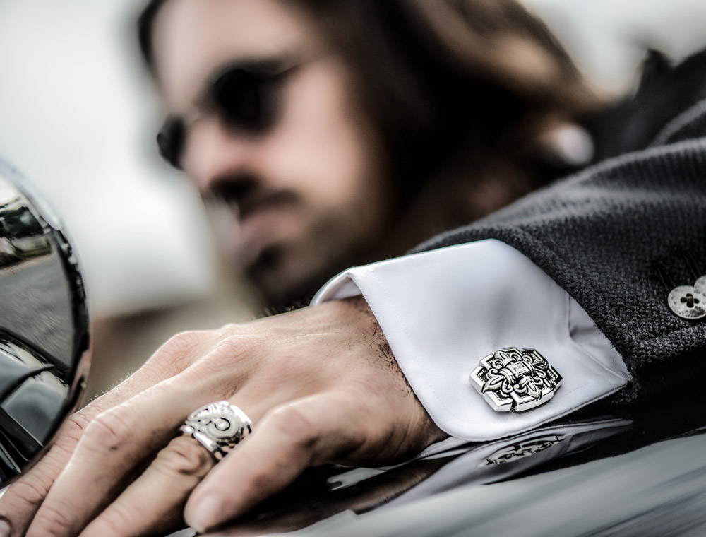 Man Driving While Wearing Sanctified Cufflinks and Aeonian Ring by NightRider Jewelry