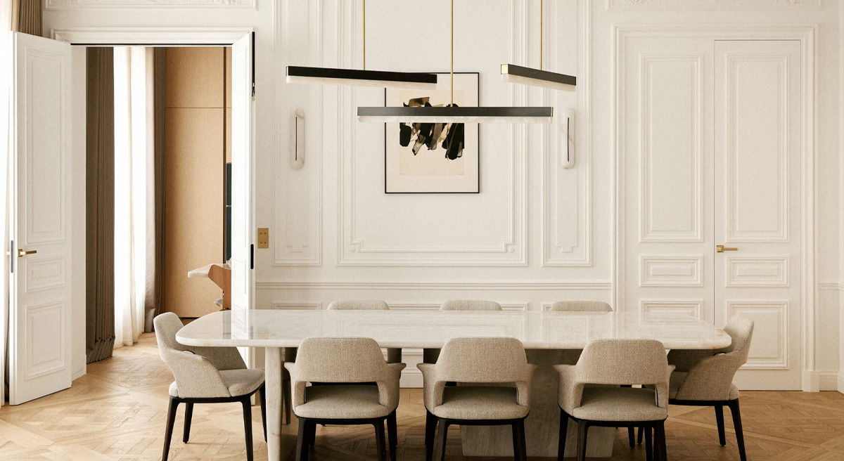 Modern dining room with a long table, chairs, and stylish CTO lighting.
